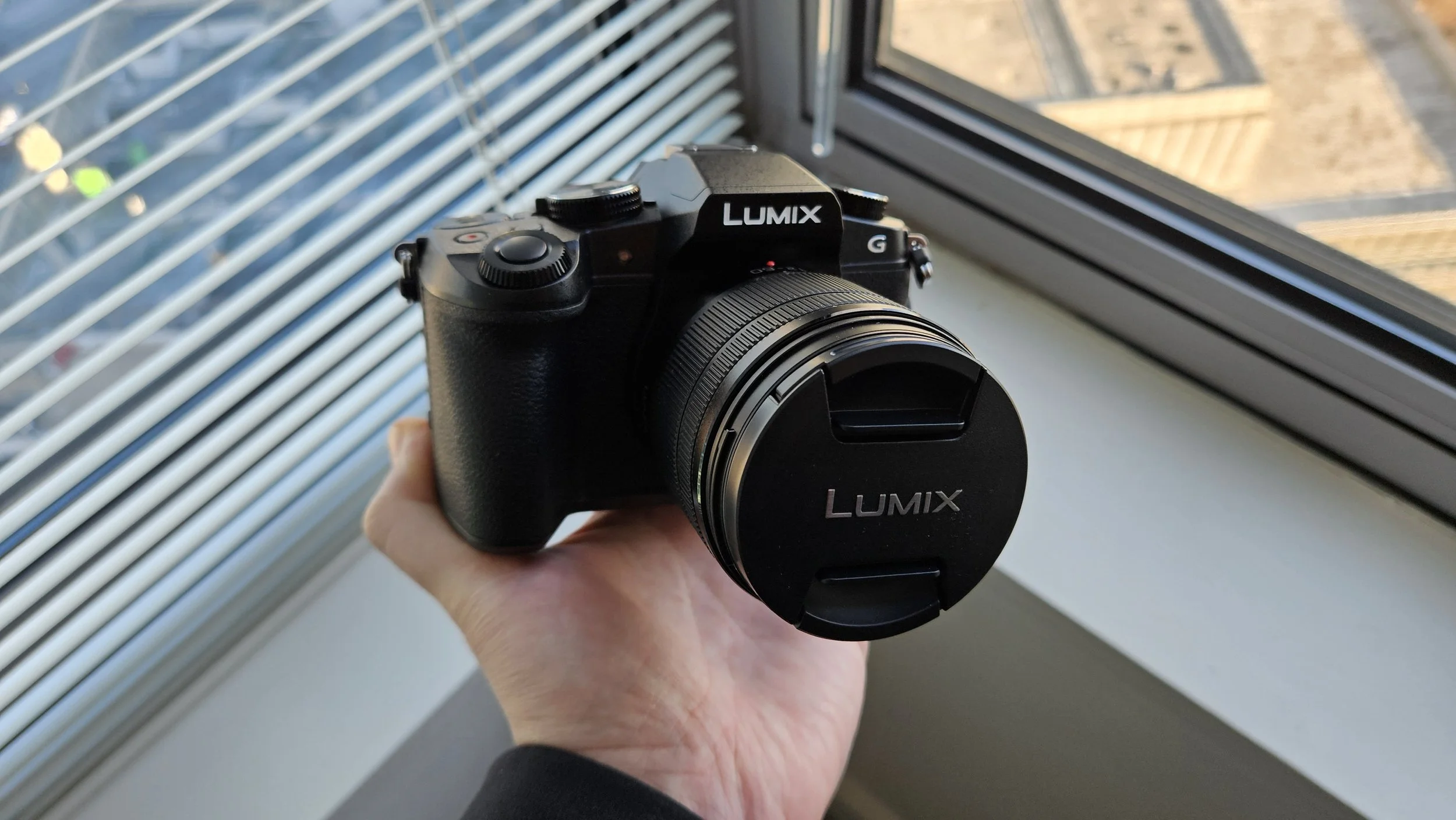 Person holding a Panasonic Lumix G85