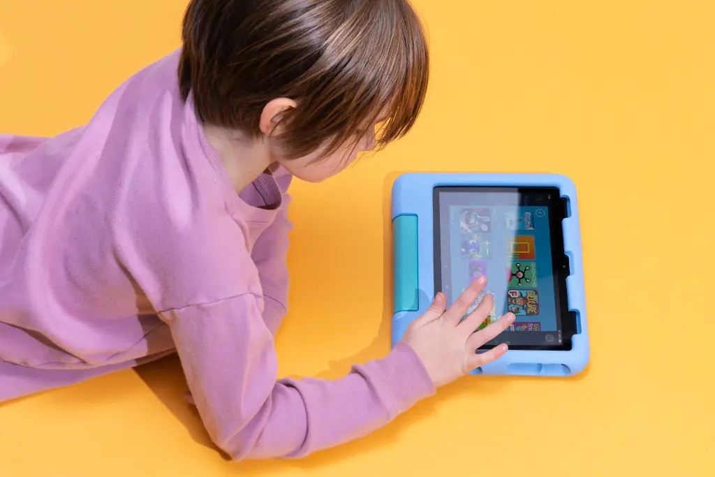 A boy playing game on a tablet